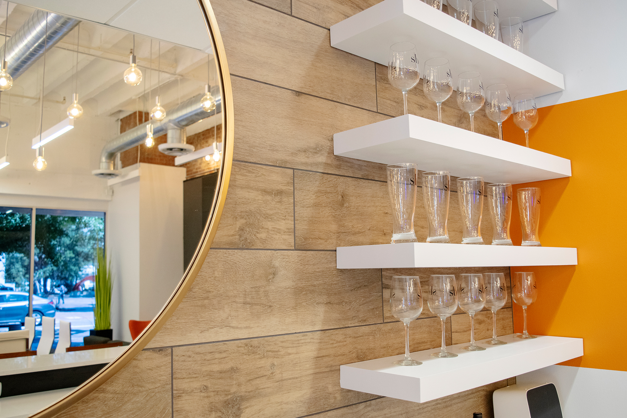 Picture of shelves holding various drinking glasses.